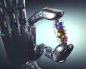 Robotic hand holding multivitamin